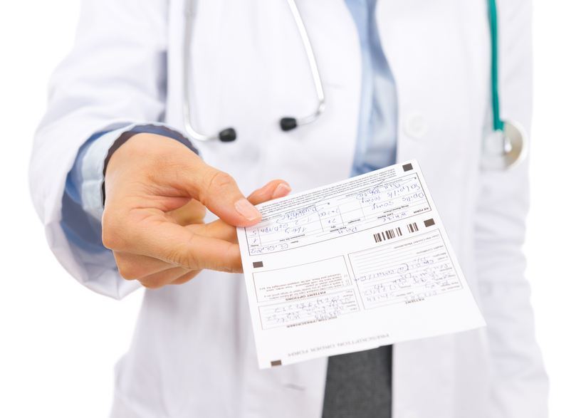 closeup on doctor woman giving prescription