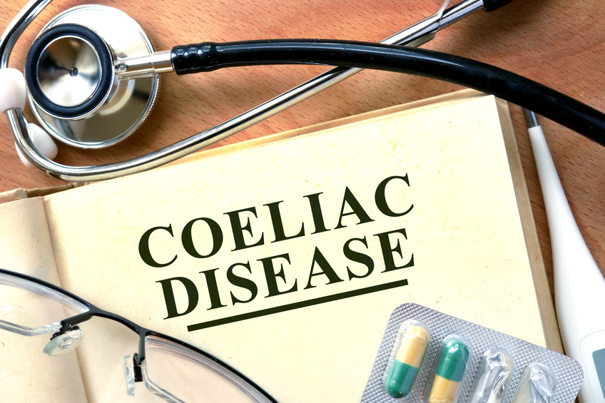 Coeliac disease concept. Book with stethoscope and pills.