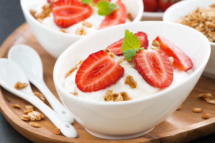 healthy breakfast - yogurt with fresh strawberries and granola