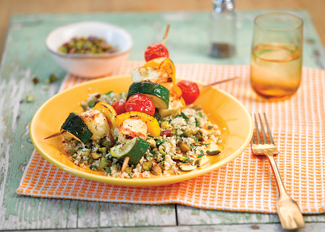 A perfect lunch for a late summers day, this cauliflower and pistachio couscous with halloumi and vegetable kebabs is sure to hit the spot!