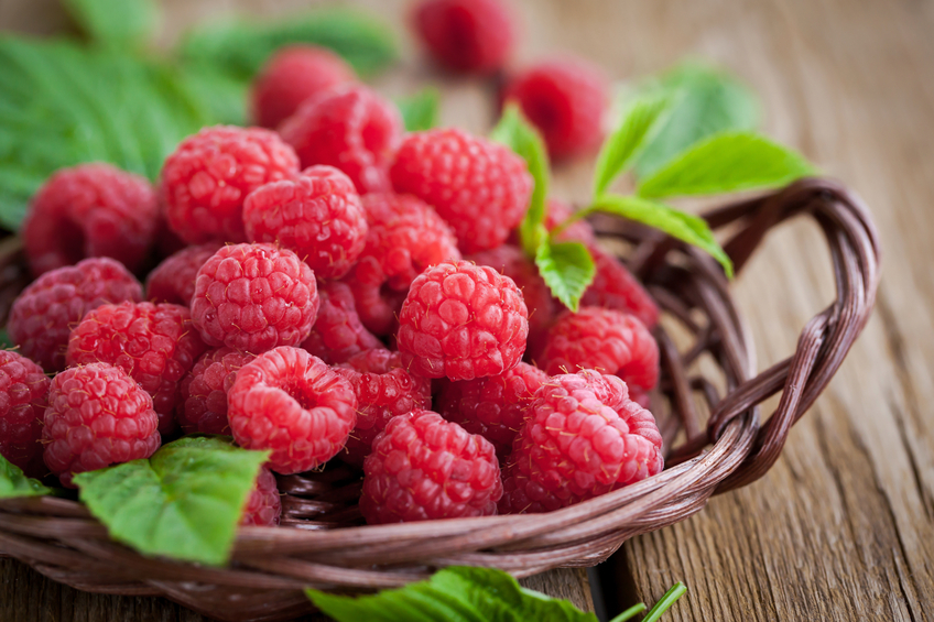 Ripe raspberry with leaf