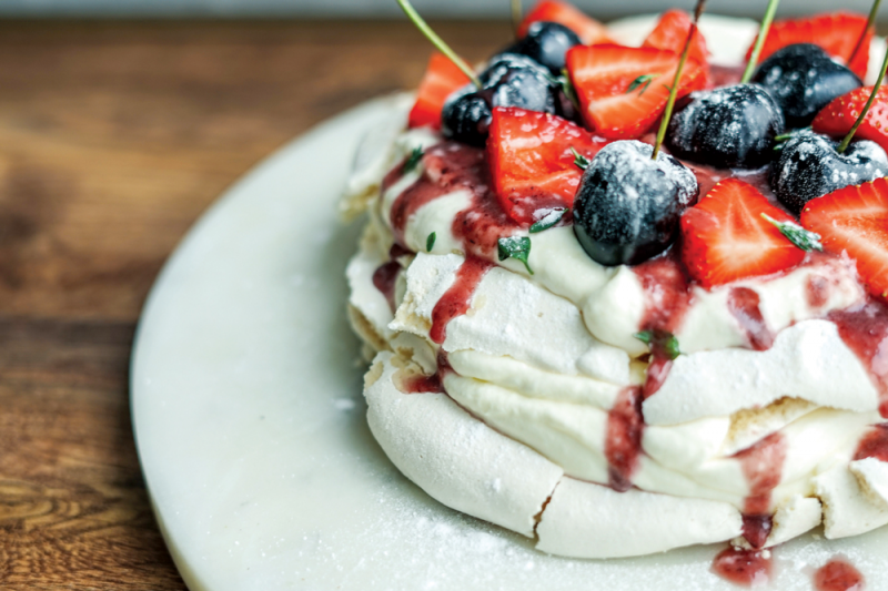 Vegan pavlova with a boozy cherry sauce