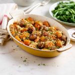 Shallots with squash and breadcrumbs